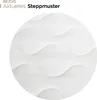 A close-up of a white quilted fabric with a wavy pattern. Produktbild-Vorschau