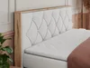 A close-up view of a bed with a tufted headboard and a mattress. Produktbild-Vorschau