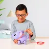 A boy is playing with a toy elephant. Anteprima dell’immagine prodotto