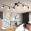 A collage showing a black ceiling track light fixture with multiple adjustable spotlights, a close-up of an LED bulb, and a hand holding a part of the fixture. Podgląd zdjęcia produktu