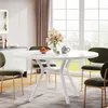 A dining room scene with a white round dining table and green chairs. Náhled obrázku produktu