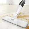 A spray mop is cleaning a wooden floor with spilled liquid. Podgląd zdjęcia produktu