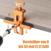 A jig for drilling holes in cabinet doors is shown attached to a wooden surface, with a drill bit inserted. Produktbild-Vorschau