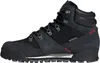 A side view of a black winter boot. Voir les images du produit