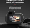A digital camera is shown in a dark, textured environment. Produktbild-Vorschau