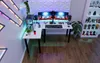 A gaming desk setup in a room with LED lighting. Anteprima dell’immagine prodotto