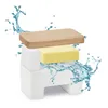 A butter dish with a wooden lid and a yellow butter stick, surrounded by water splashes. Podgląd zdjęcia produktu