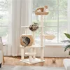 Three cats are playing on a multi-level cat tree in a room with large windows and sheer curtains. Podgląd zdjęcia produktu