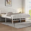 A white metal bed frame with a mattress and bedding in a bedroom setting. Produktbild-Vorschau