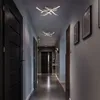 A modern hallway with dark doors and contemporary ceiling lights. Anteprima dell’immagine prodotto