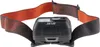 A close-up of a black headlamp with an orange and black patterned strap, set against a white background. Produktbild-Vorschau