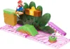 A Super Mario Bros. Soda Jungle playset with Mario figure and various obstacles. Voir les images du produit