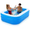 Two young people are splashing water in an inflatable swimming pool. Produktbild-Vorschau