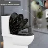 A toilet seat with a marble pattern is shown in a partially open state, with arrows indicating a slow and quiet closing motion. A sleeping baby is visible in the background. Produktbild-Vorschau