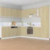 A modern kitchen with light wood cabinets and white countertops. Produktbild-Vorschau
