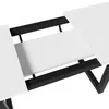 Close-up view of a white extendable table with black metal legs. Produktbild-Vorschau