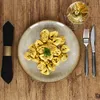 A plate of tortellini with a glass of white wine and cutlery on a wooden table. Produktbild-Vorschau
