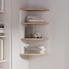 A corner shelf unit with books and decorative items. Anteprima dell’immagine prodotto