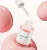 A bottle of Medicube PDRN Pink Peptide Serum is displayed with a dropper above it, surrounded by pink spheres. Voir les images du produit