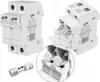 A product shot of electrical components, specifically a solar junction box and a fuse, against a white background. Podgląd zdjęcia produktu