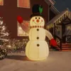 An inflatable snowman decoration is set up in front of a house with Christmas lights. Voir les images du produit