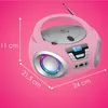 A pink Cyberlux CD player with LED lighting and radio functionality, shown against a pink background with measurement indicators. Voir les images du produit
