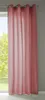 A pink curtain hanging in front of a window with trees visible outside.