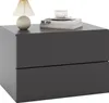 A modern, dark gray nightstand with two drawers, a lamp, and books on top, presented on a white background. Anteprima dell’immagine prodotto