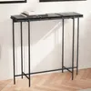 A narrow console table with a black metal frame and two dark, segmented glass top surfaces, placed against a white wall with a herringbone wooden floor. Produktbild-Vorschau