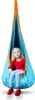 A young girl sits in a hanging cocoon swing. Voir les images du produit