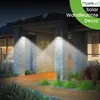 A house exterior at night with solar-powered wall lights illuminating the entrance. Produktbild-Vorschau