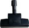 A black vacuum cleaner floor head is presented against a white background. Produktbild-Vorschau