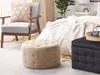 A bedroom scene with a chair, bed, and two ottomans. Náhled obrázku produktu