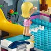 A close-up view of a LEGO Friends water park set, featuring a minifigure on a diving board overlooking a pool. Produktbild-Vorschau