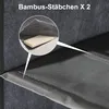 Close-up view of a dark grey fabric shelf with a detail showing a piece of bamboo and the fabric texture. Produktbild-Vorschau