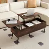 A lift-top coffee table with storage is shown in a living room setting next to a sectional sofa. Voir les images du produit