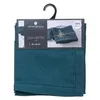 A set of teal napkins in packaging, hanging from a hook. Produktbild-Vorschau
