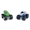 Two monster trucks are displayed against a white background. Voir les images du produit
