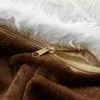 A close-up view of a partially unzipped pet bed, showing the fluffy white interior and the brown exterior fabric. Anteprima dell’immagine prodotto