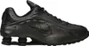 A studio shot of a single black Nike Shox R4 sneaker. Produktbild-Vorschau