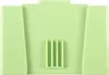 A light green plastic object with a ribbed section in the center and angled sides. Náhled obrázku produktu