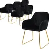 A set of six black velvet dining chairs with gold legs are arranged on a white background. Náhled obrázku produktu