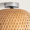 Close-up of a woven bamboo lampshade attached to a silver ceiling mount. Produktbild-Vorschau