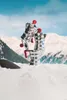 A Moka pot is placed on snow with a snowy mountain range and blue sky in the background. Produktbild-Vorschau