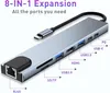 A silver USB-C hub is shown on a white background with labels pointing to its various ports. Produktbild-Vorschau