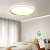 A modern bedroom with a ceiling light and a bed. Podgląd zdjęcia produktu