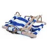 A baby swing seat with blue and white stripes, made of fabric and wood, on a white background. Produktbild-Vorschau