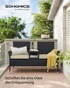 A black rattan bench with beige cushions and a yellow throw blanket on a balcony. Produktbild-Vorschau