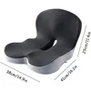A dark gray ergonomic seat cushion with light gray sides, shown from a diagonal angle against a white background. Dimensions are indicated with lines and text. Produktbild-Vorschau
