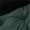 A close-up view of a green pet bed with a black background. Voir les images du produit